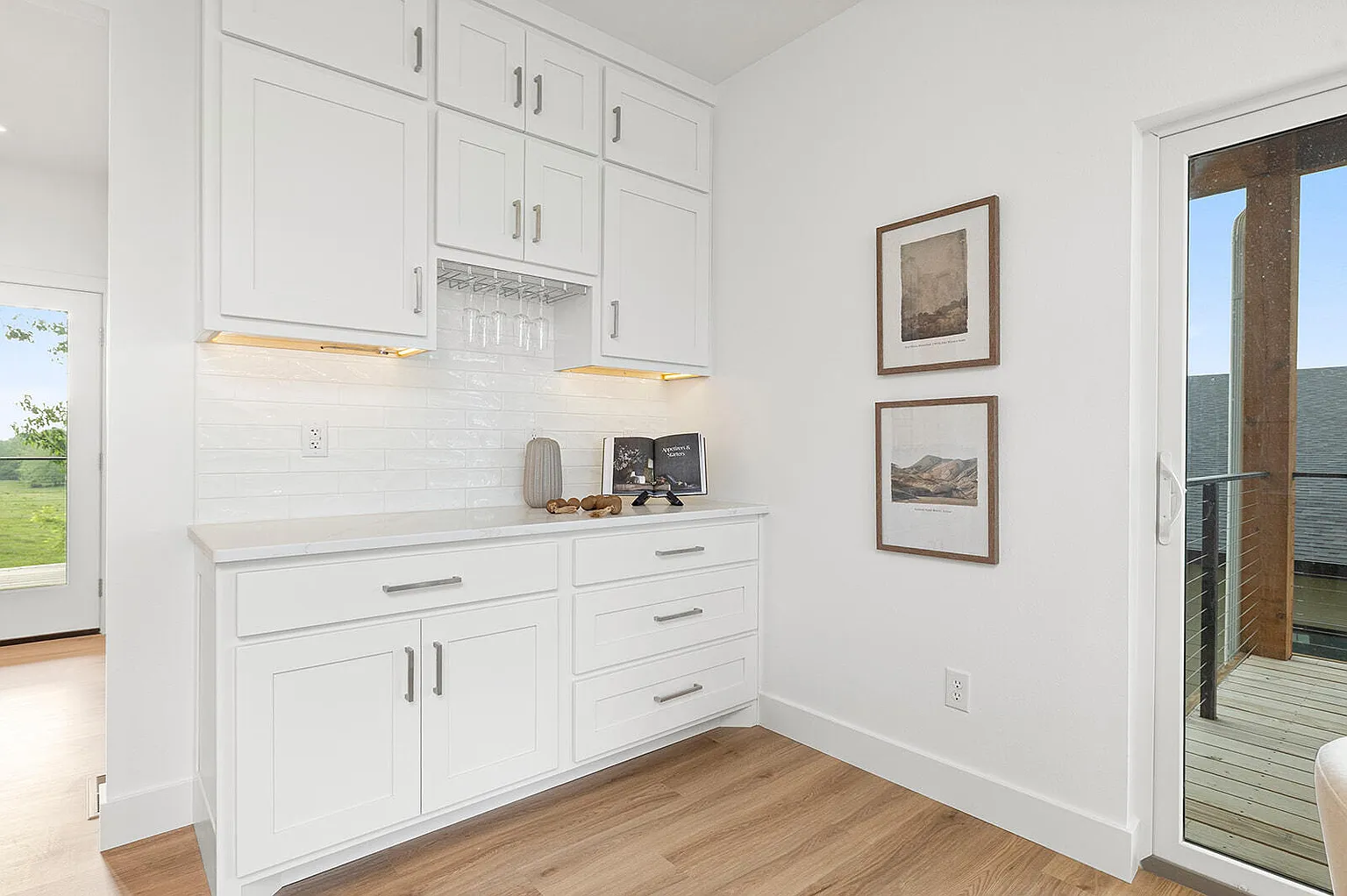 Butlers pantry with dry bar and wine glass storage after staging - 2807 S 14th Ave, Ozark, MO