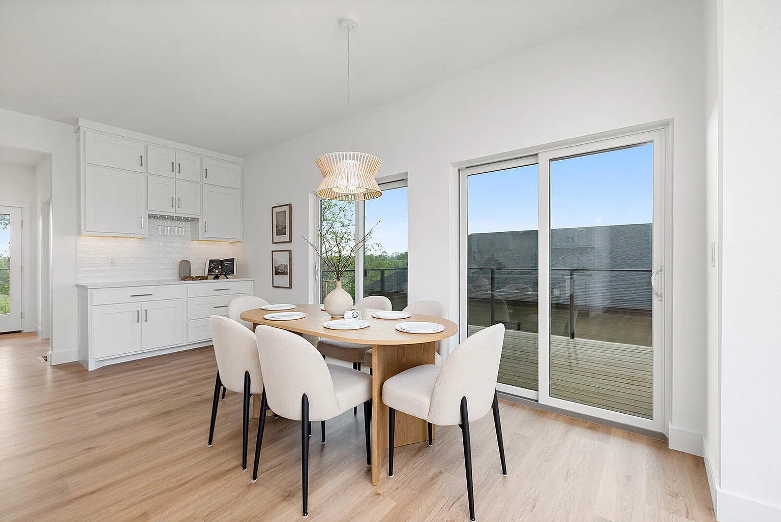 Dining area with round table, upholstered chairs and patio view - 2807 S 14th Ave, Ozark, MO