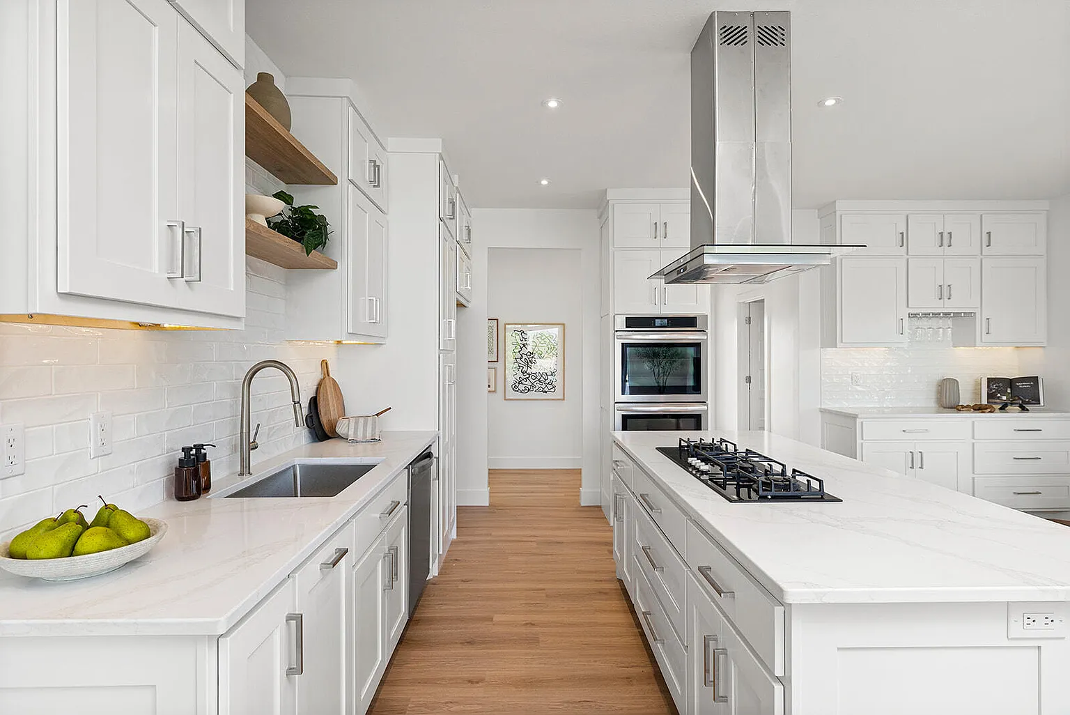 Galley kitchen with marble island, gas cooktop and double oven - 2807 S 14th Ave, Ozark, MO