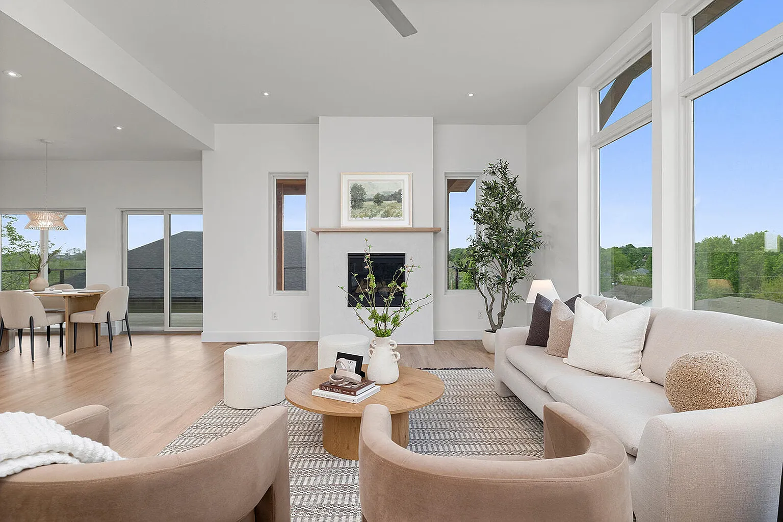 Living room view toward dining area after staging - 2807 S 14th Ave, Ozark, MO