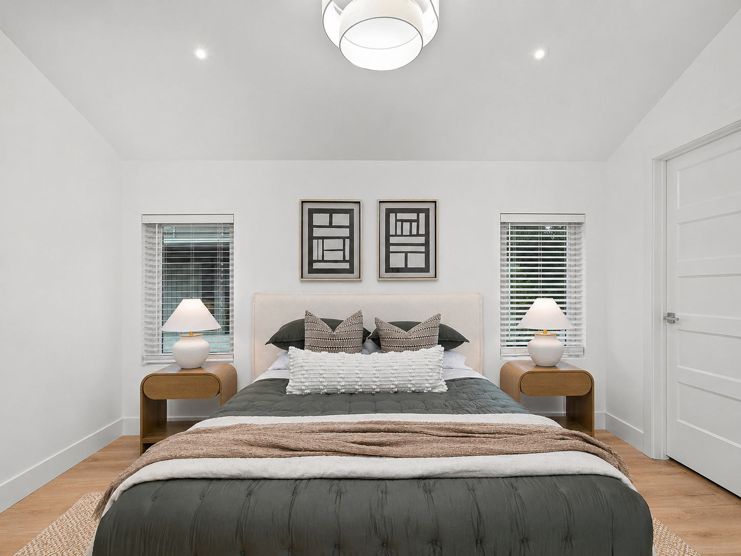 Master bedroom front view with upholstered bed and matching nightstands - 2807 S 14th Ave, Ozark, MO