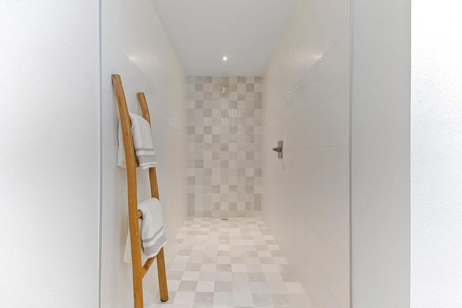 Tile walk-in shower with wooden towel ladder - 2807 S 14th Ave, Ozark, MO home staging
