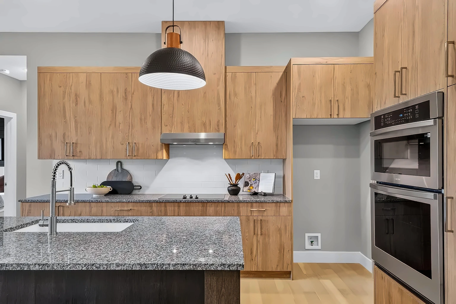 Kitchen with granite counters, cooktop, subway-tile backsplash and stainless double wall oven - 5048 Swale, Springfield, MO