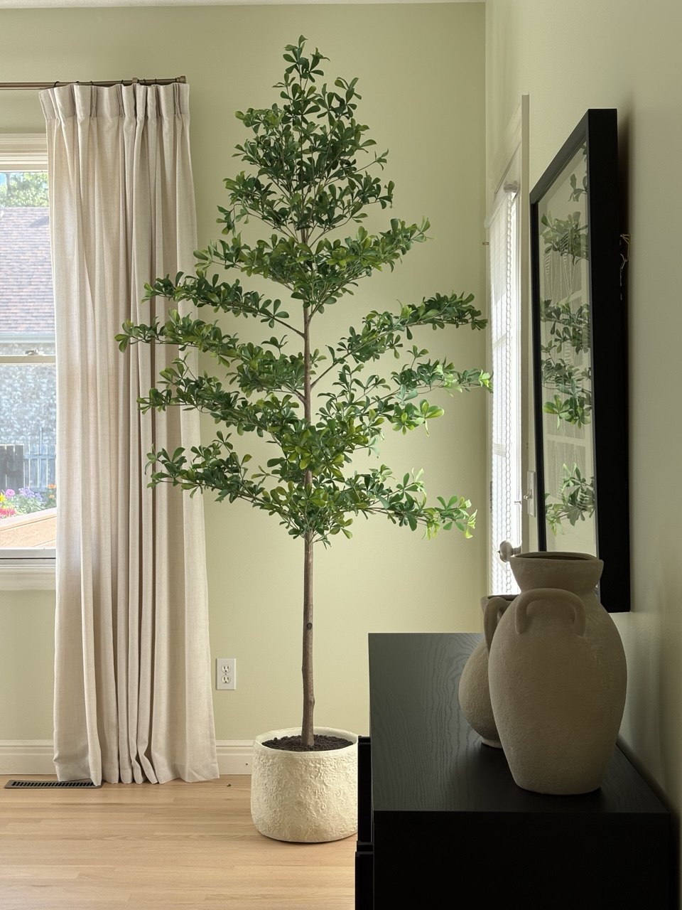 Primary bedroom olive tree styling with linen curtains and ceramic vases - Gaslight Drive, Springfield, MO home staging
