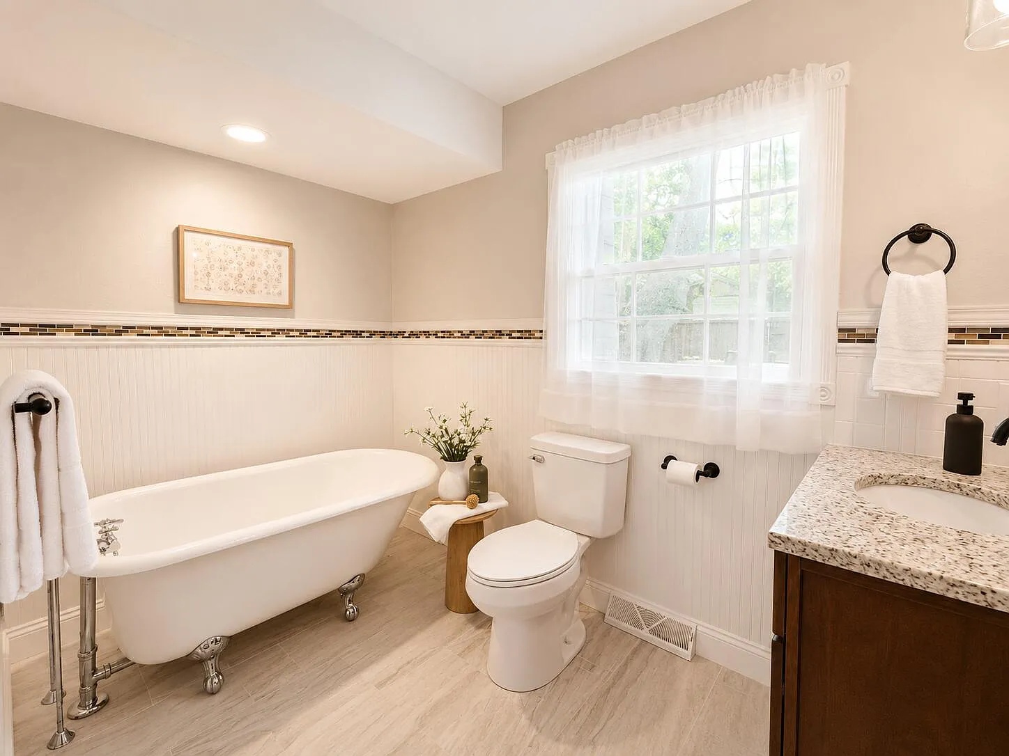 Bathroom with clawfoot tub after home staging on West Ellison Drive, Springfield, MO